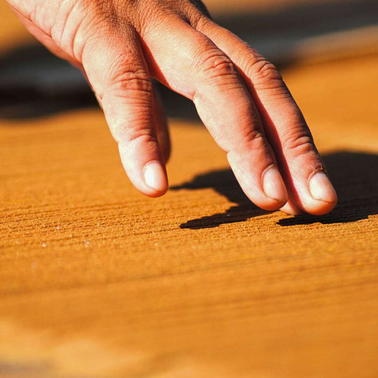 hands making incense sticks 