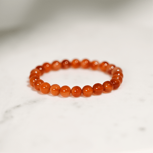 Carnelian gemstone bracelet promotes Sacral Chakra balance, enhancing vitality, confidence, and creativity.