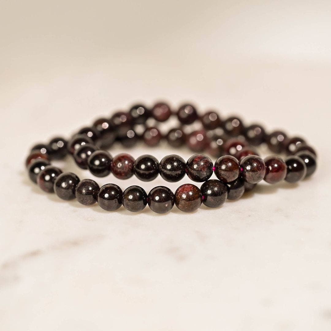 Garnet Crystal Bracelets on table 