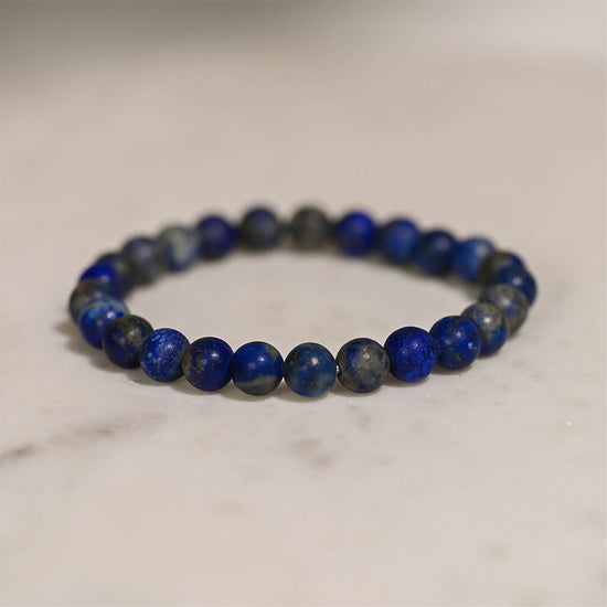 Lapis Lazuli Crystal Bracelet on table 