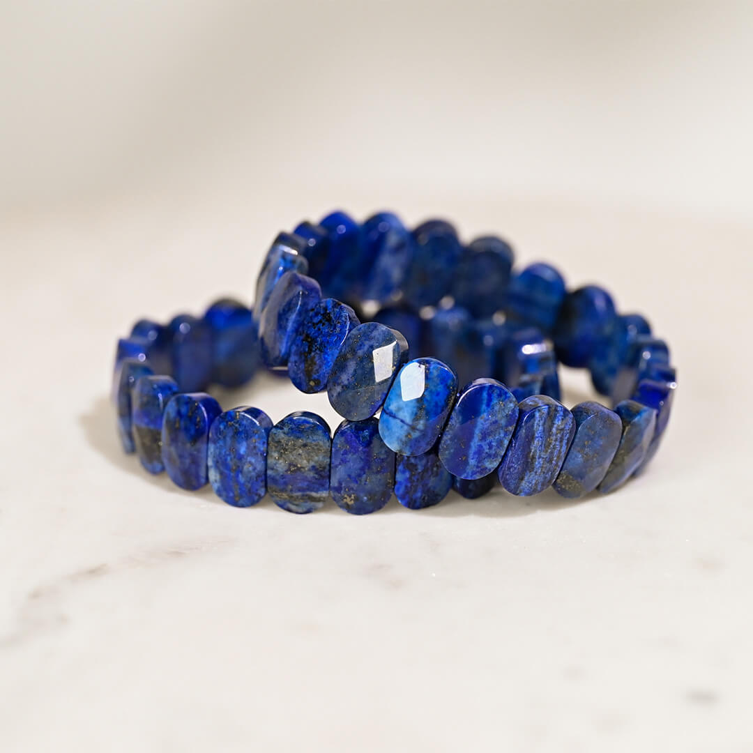 2 Lapis Lazuli bracelets on white table 