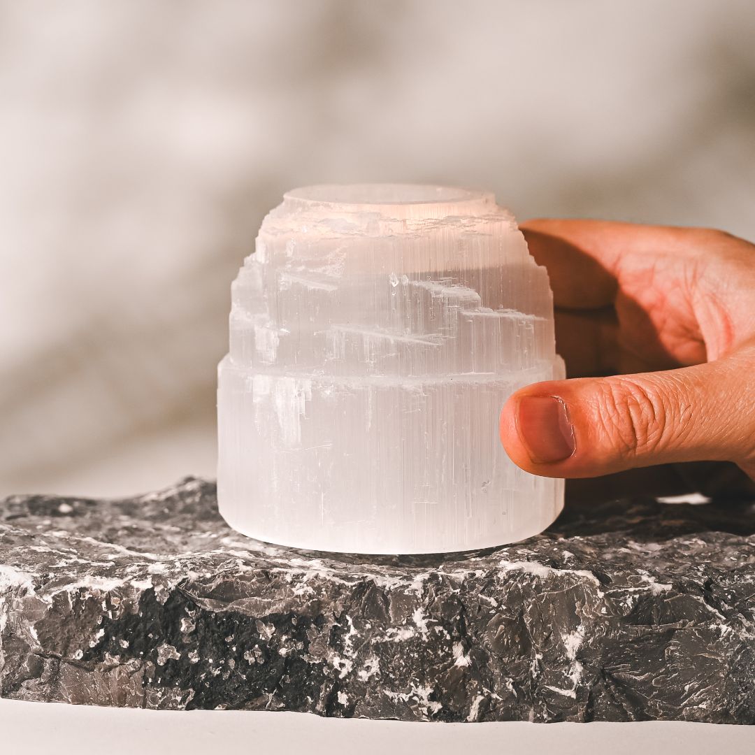 Selenite Candle Holder being placed on a hard surface