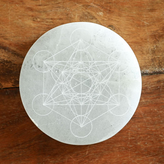 Selenite Grid Plate with Metatron pattern on the table 