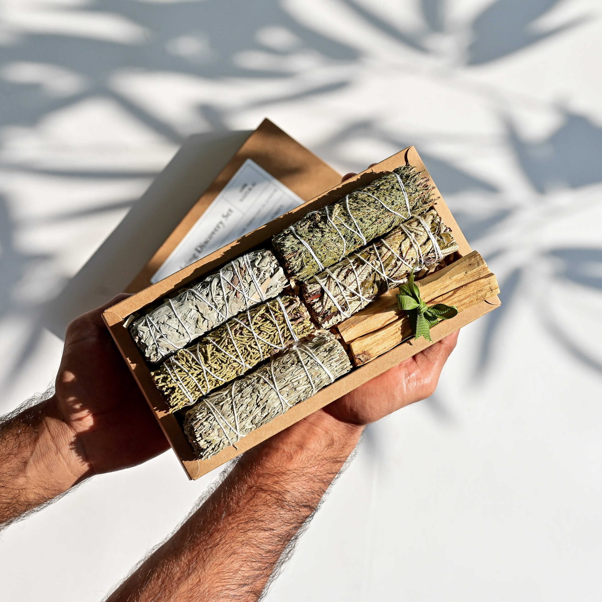 A man holding Smudging Discovery Set